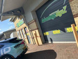 Car infront of the Advantage Signz garage