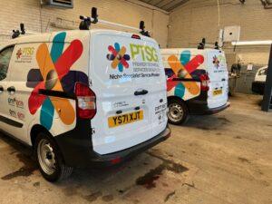 PTSG trucks lined up in a warehouse