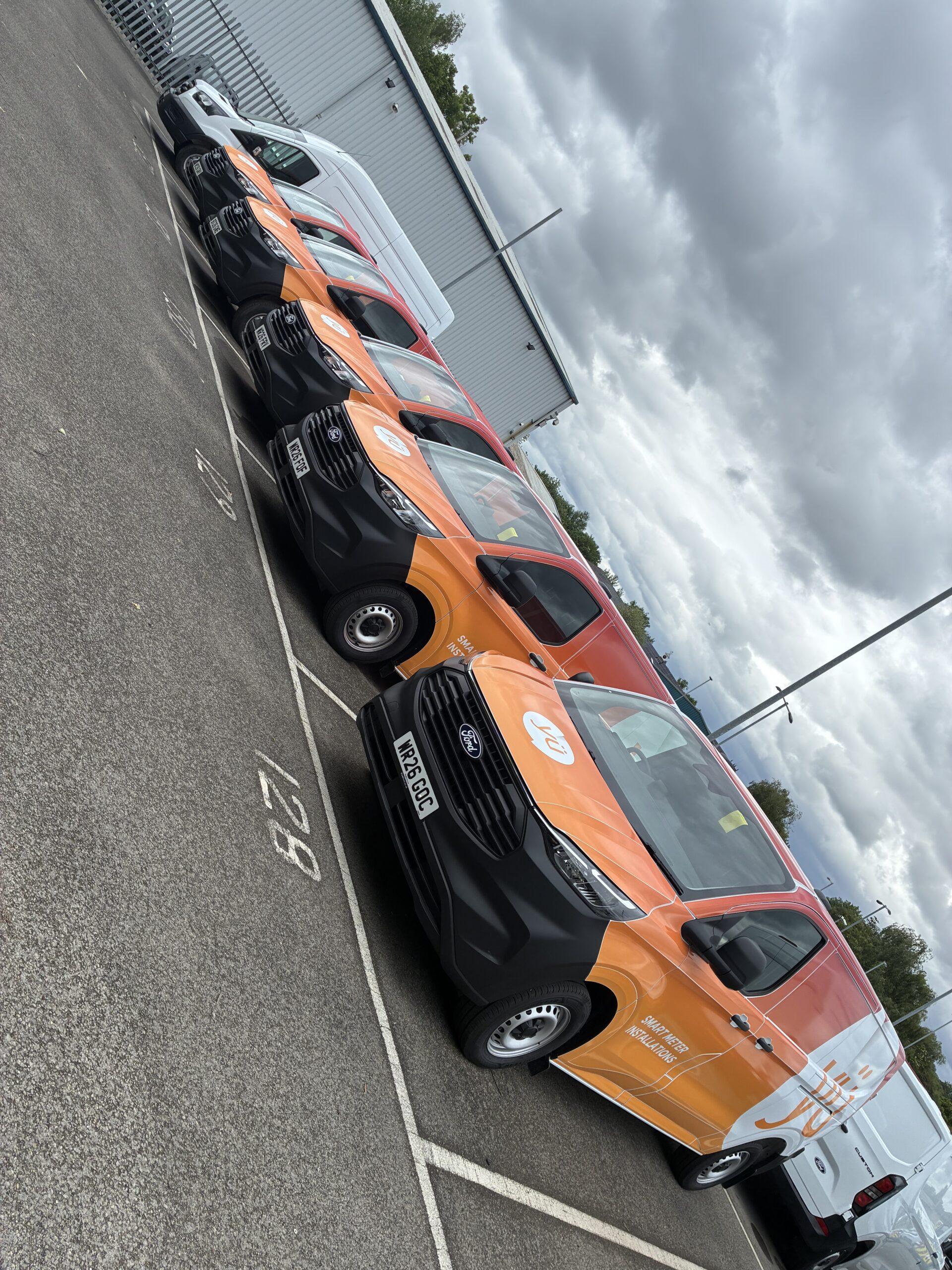 Segmented Vehicle Wrapped Vans in a row